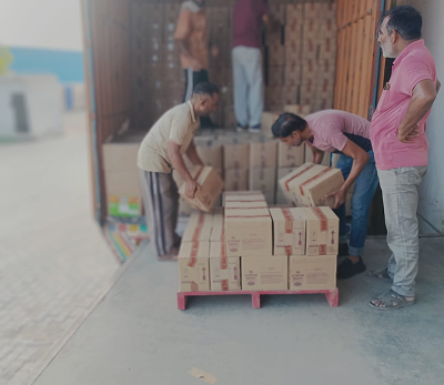 Warehouse worker stacking boxes